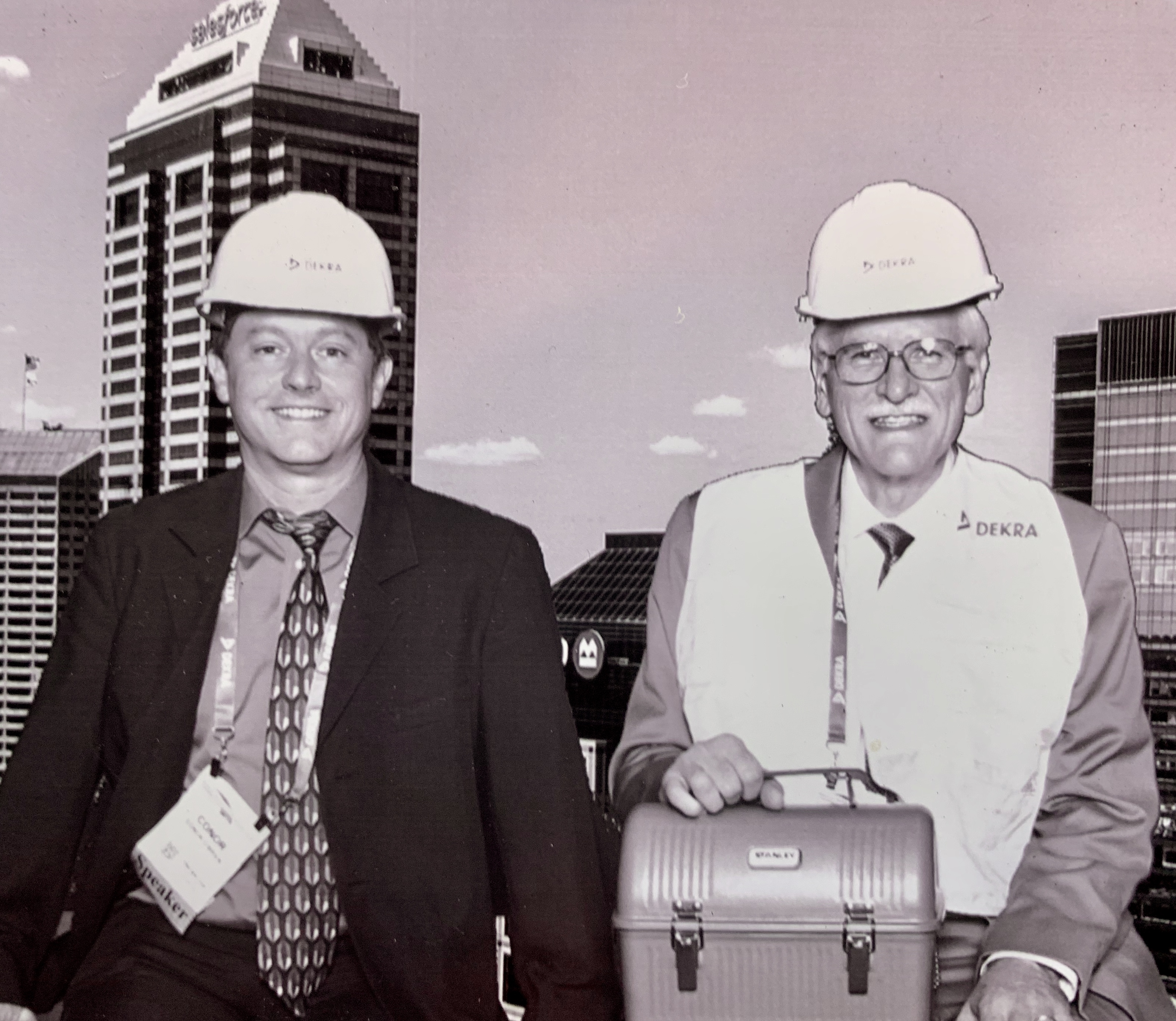 An archival black-and-white photo of two men in hard hats