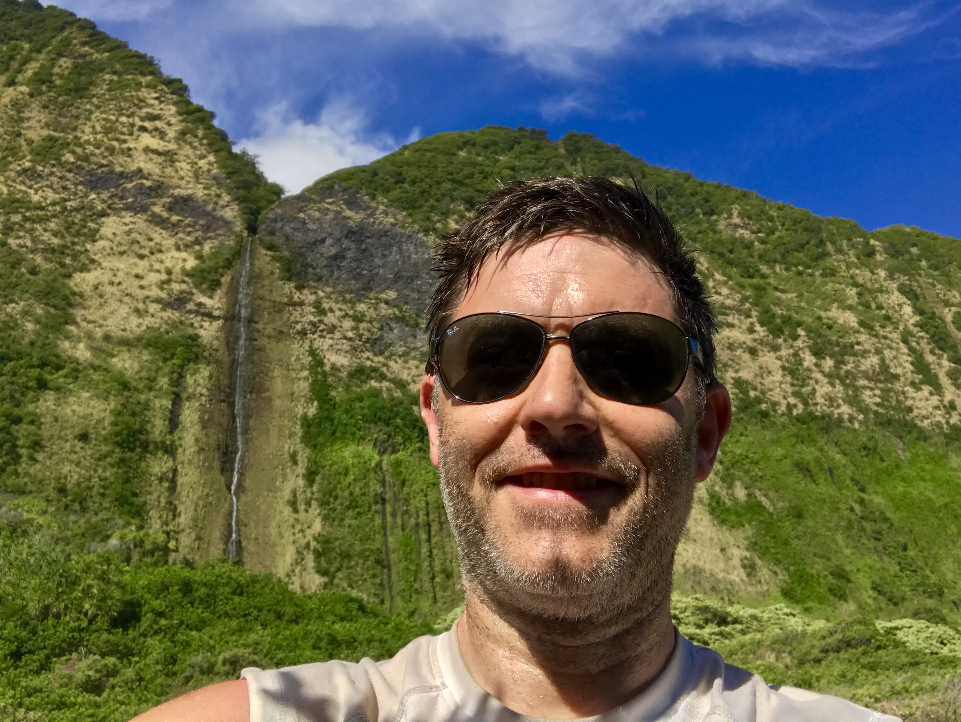 Conor with a waterfall in the background