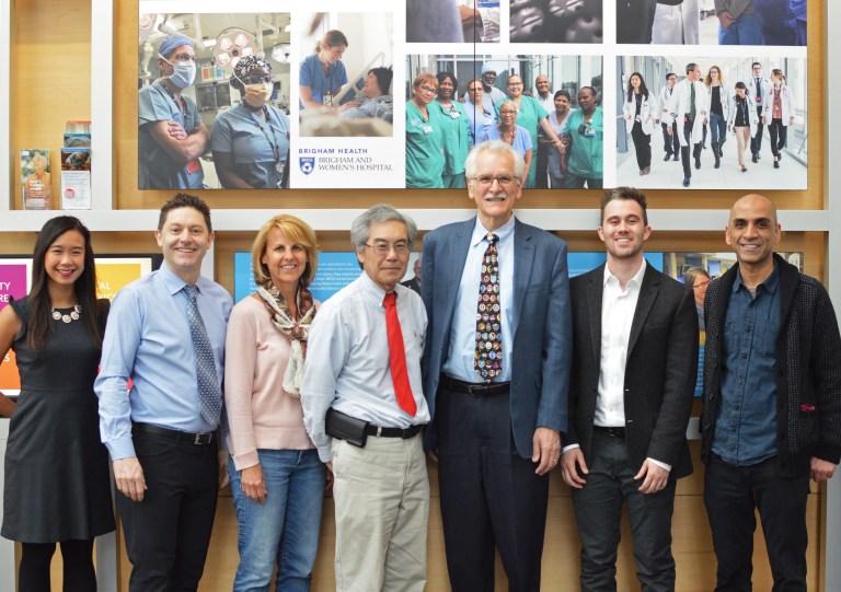 A group photo of colleagues indoors